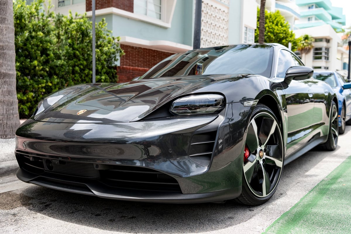 Luxury electric sports car Porsche Taycan parked outdoor
